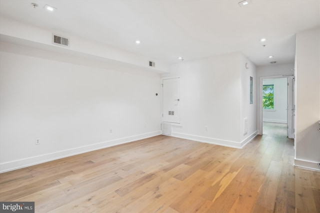 5110 Fort Totten Dr NE Unit P4, Washington, DC 20011 - empty room with light wood-style floors, baseboards, recessed lighting, and fire sprinkler in ceiling