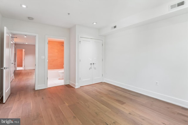 5110 Fort Totten Dr NE Unit P4, Washington, DC 20011 - unfurnished bedroom featuring light wood-style floors, baseboards, ensuite bathroom, recessed lighting, and a closet