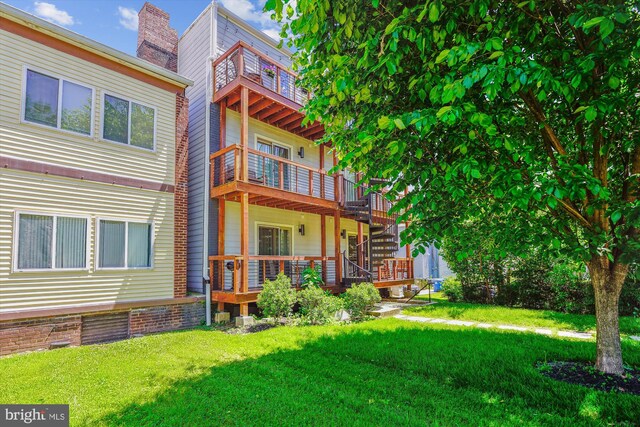 5110 Fort Totten Dr NE Unit P4, Washington, DC 20011 - rear view of property with a balcony, a lawn, and stairs