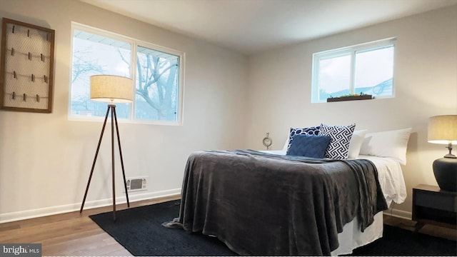 8802 Ashford Rd, Parkville, MD 21234 - bedroom featuring wood finished floors and baseboards