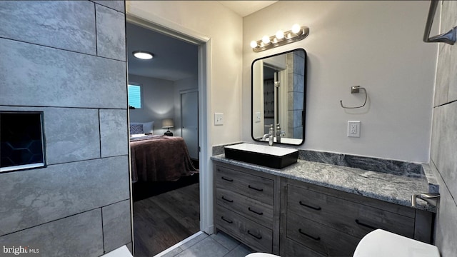 8802 Ashford Rd, Parkville, MD 21234 - bathroom featuring ensuite bathroom, vanity, and tile patterned flooring