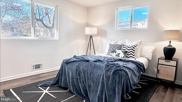 8802 Ashford Rd, Parkville, MD 21234 - bedroom with baseboards and dark wood-type flooring