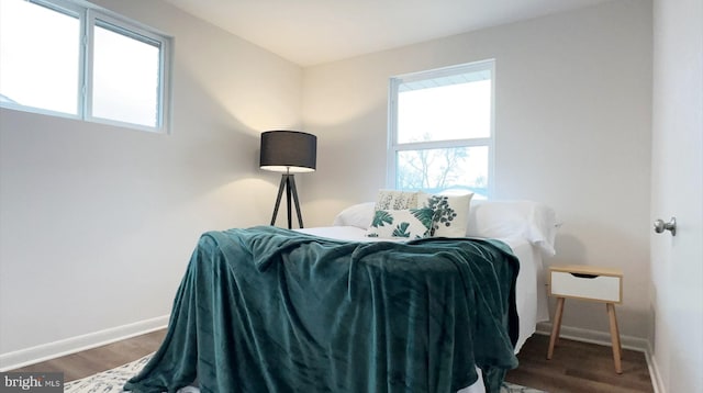 8802 Ashford Rd, Parkville, MD 21234 - bedroom featuring baseboards and wood finished floors