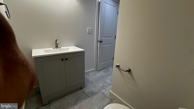 8802 Ashford Rd, Parkville, MD 21234 - bathroom with baseboards, vanity, toilet, and tile patterned floors