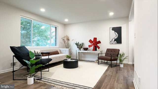 8802 Ashford Rd, Parkville, MD 21234 - living area with wood finished floors, baseboards, and recessed lighting