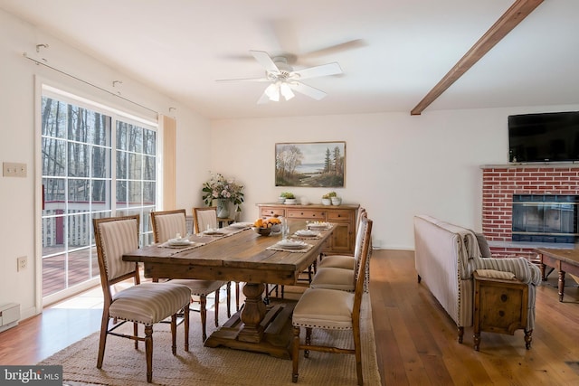 251 Depuy Dr, Pocono Lake, PA 18347 - dining area featuring hardwood / wood-style flooring, ceiling fan, and a fireplace