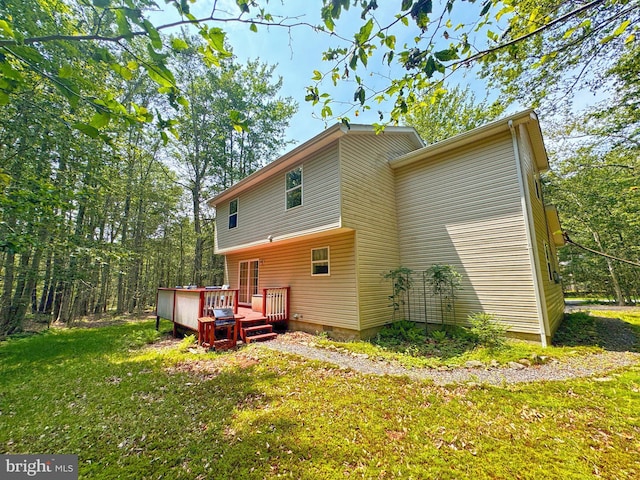 251 Depuy Dr, Pocono Lake, PA 18347 - rear view of house featuring a wooden deck and a lawn
