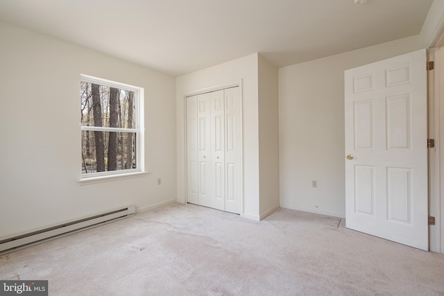 251 Depuy Dr, Pocono Lake, PA 18347 - unfurnished bedroom with a baseboard heating unit, carpet flooring, a closet, and baseboards