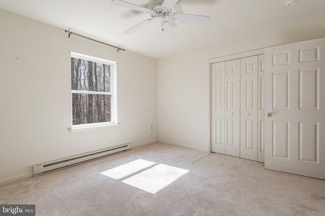 251 Depuy Dr, Pocono Lake, PA 18347 - unfurnished bedroom featuring a baseboard heating unit, carpet, a closet, and ceiling fan