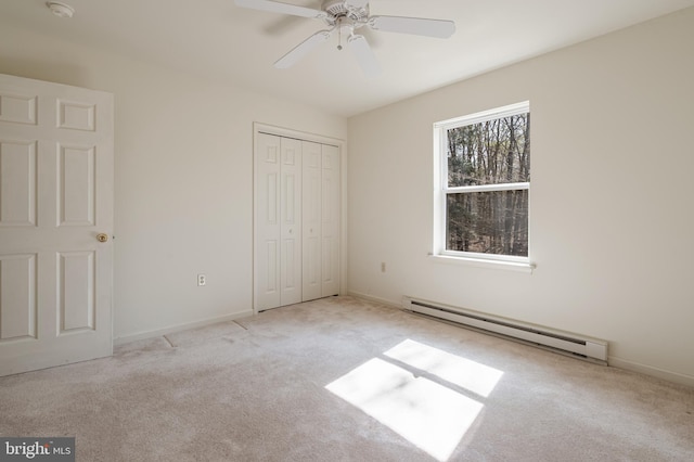 251 Depuy Dr, Pocono Lake, PA 18347 - unfurnished bedroom with a baseboard heating unit, carpet flooring, a closet, and baseboards