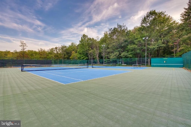 251 Depuy Dr, Pocono Lake, PA 18347 - view of tennis court with fence and view of scattered trees