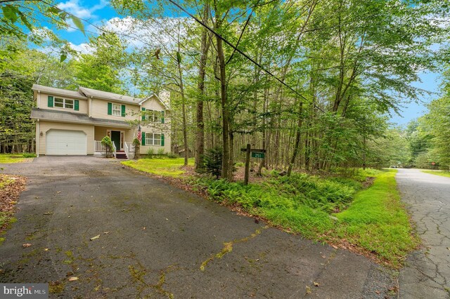 251 Depuy Dr, Pocono Lake, PA 18347 - view of front facade with driveway and a garage