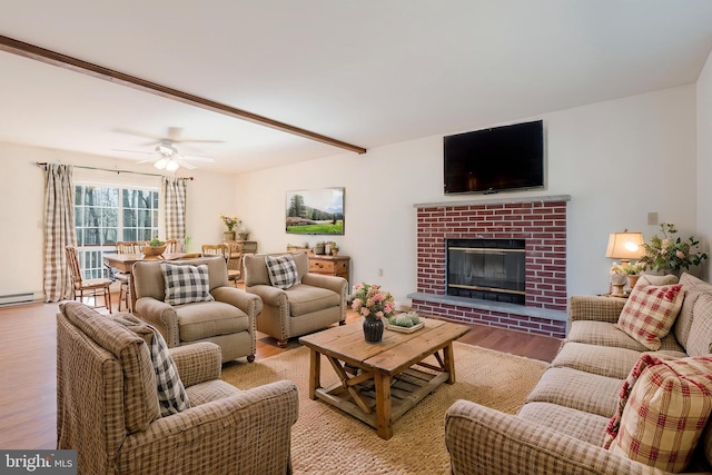 251 Depuy Dr, Pocono Lake, PA 18347 - living room with light wood-style floors, a fireplace, a ceiling fan, and a baseboard heating unit