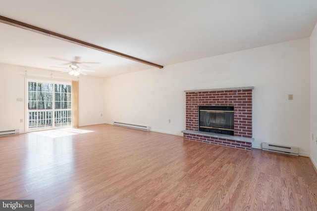 251 Depuy Dr, Pocono Lake, PA 18347 - unfurnished living room featuring a baseboard radiator, wood finished floors, ceiling fan, and a brick fireplace