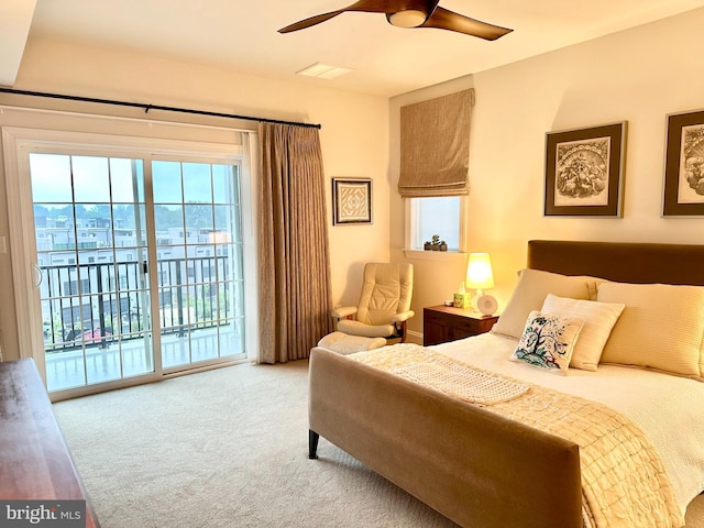carpeted bedroom with access to exterior, multiple windows, and ceiling fan