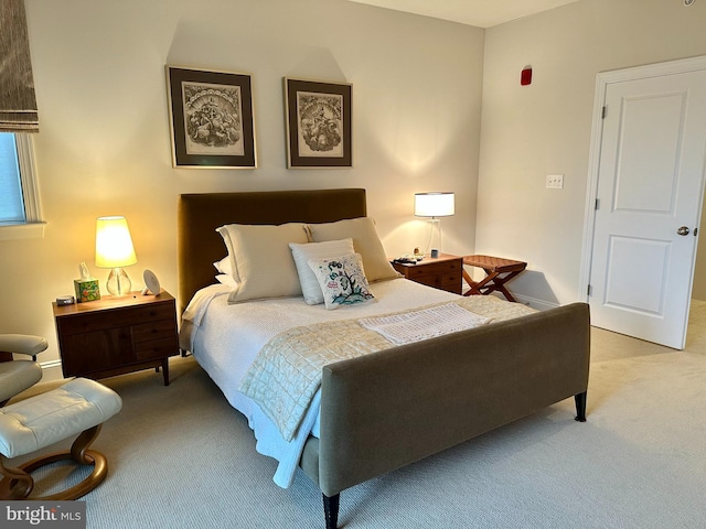 carpeted bedroom with baseboards