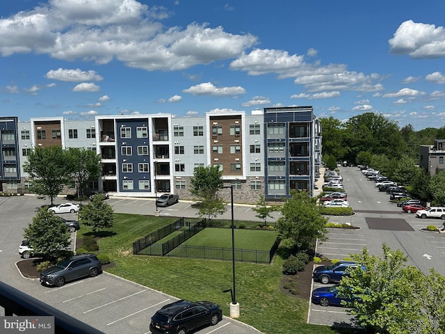view of property featuring uncovered parking