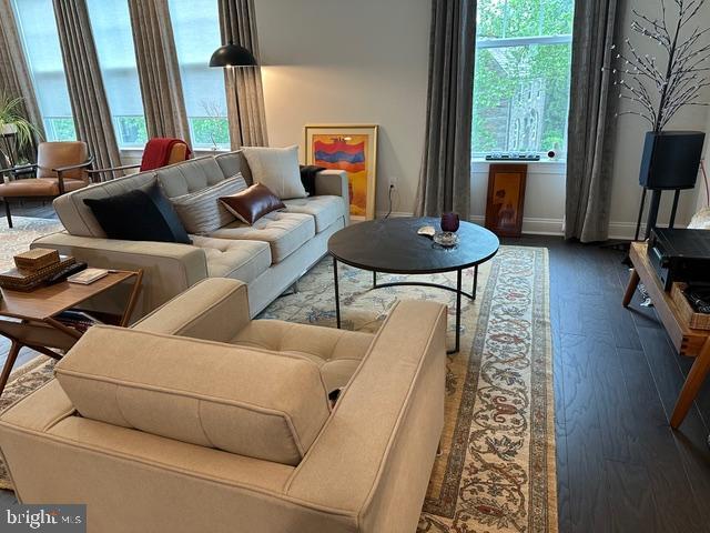 living room with wood finished floors and baseboards