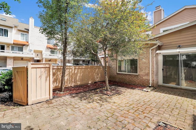 view of patio featuring fence