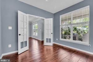 42783 Freedom St, Chantilly, VA 20152 - empty room with french doors and wood finished floors