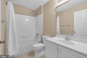 42783 Freedom St, Chantilly, VA 20152 - bathroom featuring vanity, shower / bath combo, and tile patterned floors
