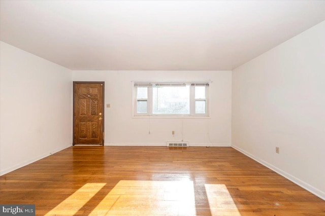 1426 W 11th St, Frederick, MD 21702 - empty room with wood finished floors and baseboards