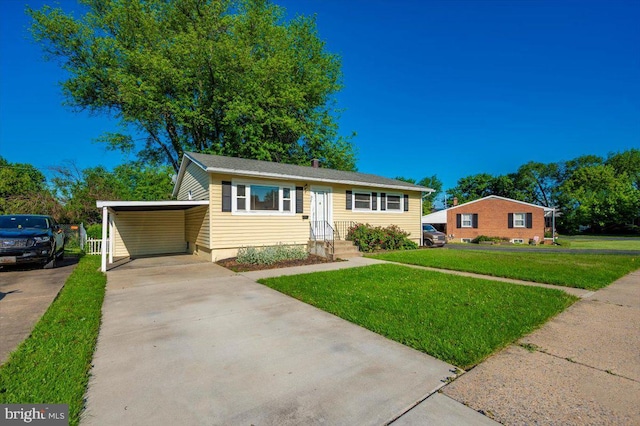 1426 W 11th St, Frederick, MD 21702 - view of front of property featuring a front lawn, driveway, and a carport