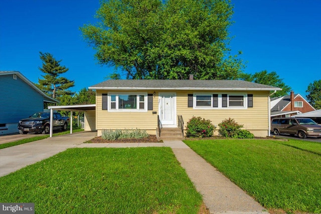 1426 W 11th St, Frederick, MD 21702 - bungalow-style home featuring a front lawn, concrete driveway, and a carport