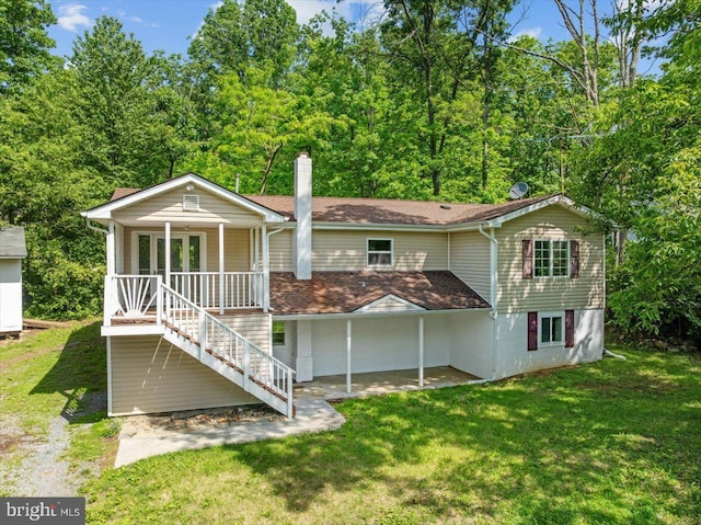 228 Doe Trl, Winchester, VA 22602 - rear view of property featuring a yard, stairs, and covered porch