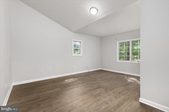 228 Doe Trl, Winchester, VA 22602 - empty room with lofted ceiling, wood finished floors, and baseboards