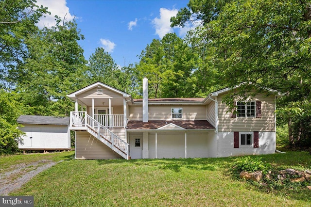 228 Doe Trl, Winchester, VA 22602 - view of front of home featuring stairs, a front lawn, covered porch, and view of wooded area