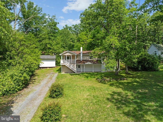 228 Doe Trl, Winchester, VA 22602 - view of green lawn featuring driveway, stairway, and an outdoor structure