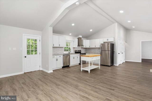 228 Doe Trl, Winchester, VA 22602 - kitchen featuring stainless steel appliances, vaulted ceiling, wooden counters, open floor plan, and a sink
