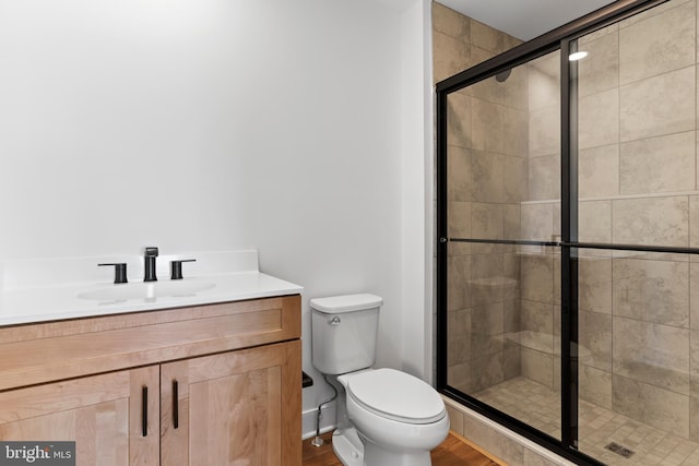 5 Graze Way, Carlisle, PA 17015 - full bathroom featuring a stall shower, toilet, wood finished floors, and vanity