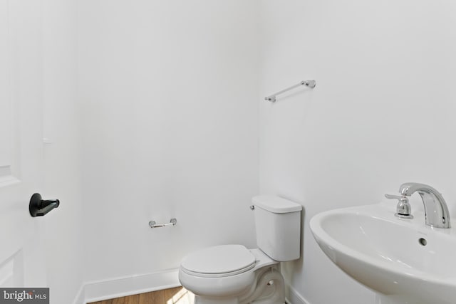 5 Graze Way, Carlisle, PA 17015 - half bathroom with a sink, baseboards, wood finished floors, and toilet