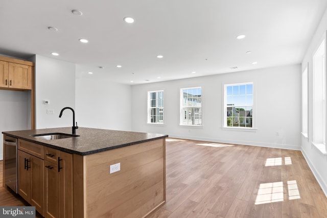 5 Graze Way, Carlisle, PA 17015 - kitchen featuring a sink, light wood-style floors, dark stone countertops, a kitchen island with sink, and recessed lighting