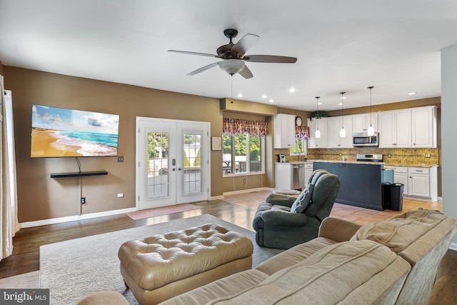 123 Nantucket Dr, Middletown, DE 19709 - living area featuring french doors, a ceiling fan, baseboards, light wood-type flooring, and recessed lighting