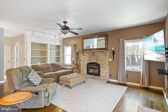 123 Nantucket Dr, Middletown, DE 19709 - living room with ceiling fan, healthy amount of natural light, wood finished floors, and a fireplace