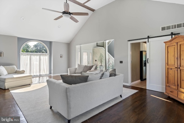 123 Nantucket Dr, Middletown, DE 19709 - living room with high vaulted ceiling, ceiling fan, wood finished floors, a barn door, and baseboards