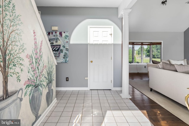 123 Nantucket Dr, Middletown, DE 19709 - entryway with decorative columns, light tile patterned flooring, and baseboards