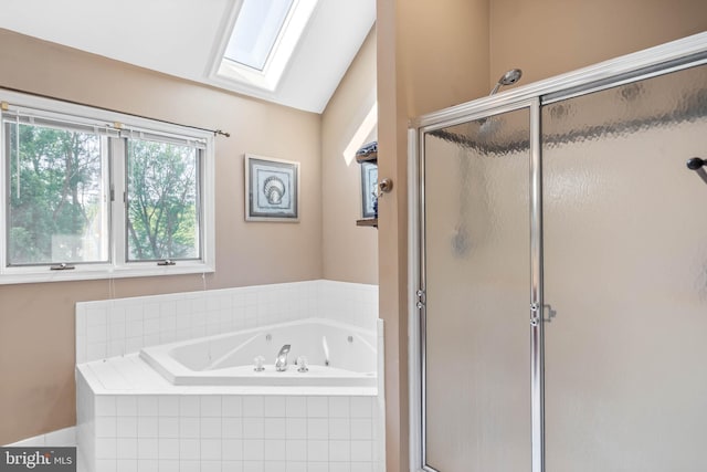 123 Nantucket Dr, Middletown, DE 19709 - bathroom featuring a skylight, a stall shower, a whirlpool tub, and vaulted ceiling