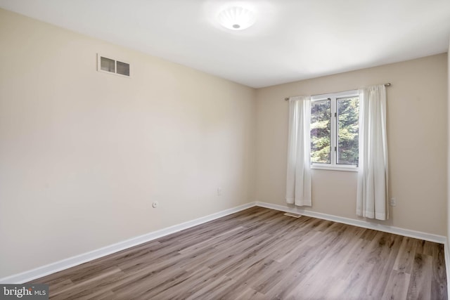 123 Nantucket Dr, Middletown, DE 19709 - empty room with wood finished floors and baseboards