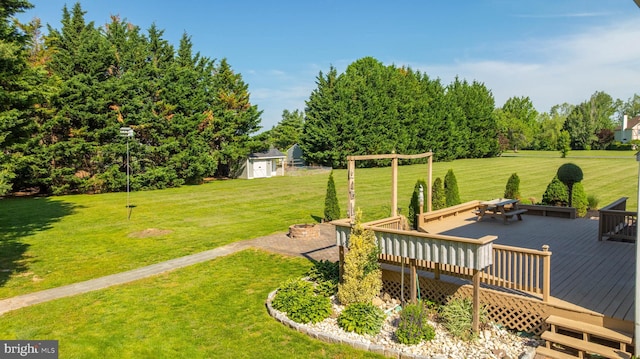 123 Nantucket Dr, Middletown, DE 19709 - view of grassy yard with a wooden deck and an outdoor structure