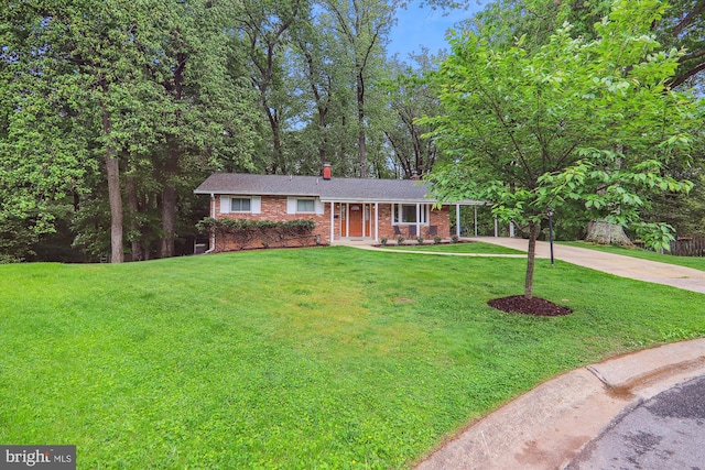 ranch-style home with driveway, brick siding, a chimney, and a front lawn