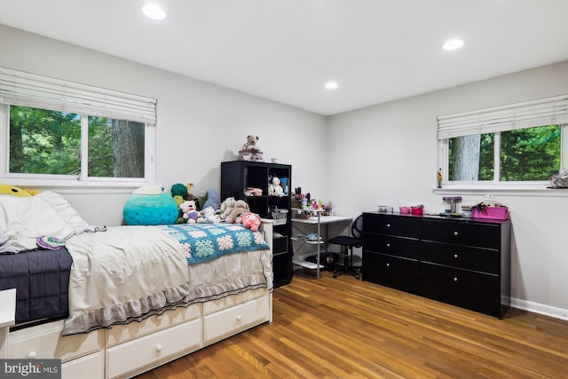 bedroom featuring wood finished floors and recessed lighting
