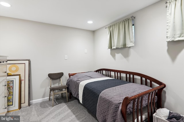 carpeted bedroom featuring recessed lighting and baseboards