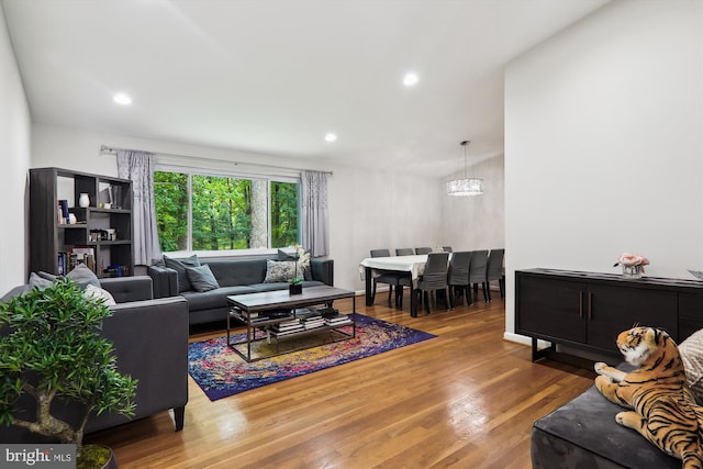 living room with wood finished floors and recessed lighting