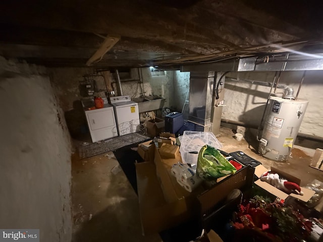unfinished basement featuring washing machine and dryer, water heater, a sink, and heating unit