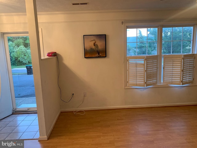 1170 Hisey Ave, Woodstock, VA 22664 - spare room with light wood finished floors, crown molding, baseboards, and a textured ceiling