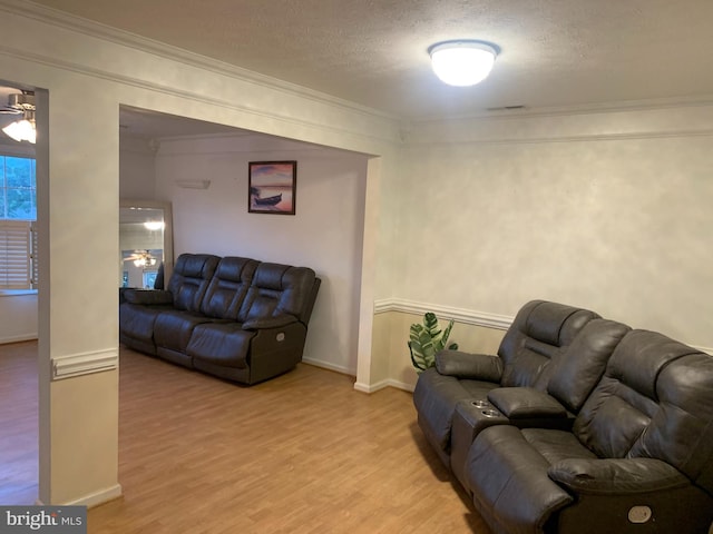 1170 Hisey Ave, Woodstock, VA 22664 - living area with a ceiling fan, light wood-type flooring, ornamental molding, a textured ceiling, and baseboards